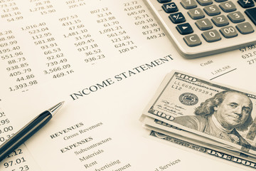 Money and income statement report in sepia tone